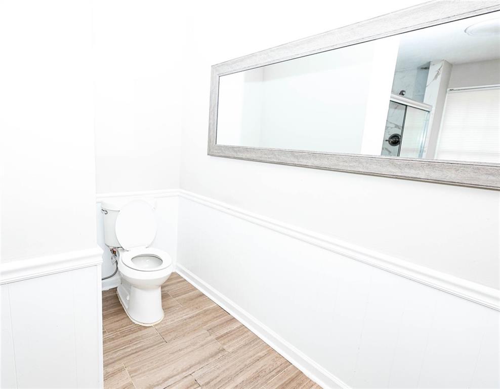 218 East Bonacre Road Cataula, GA 31804 - Photo 23 of 36 a bathroom with a toilet and a mirror
