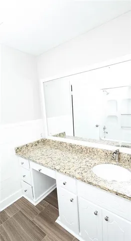 a bathroom with a toilet and a window