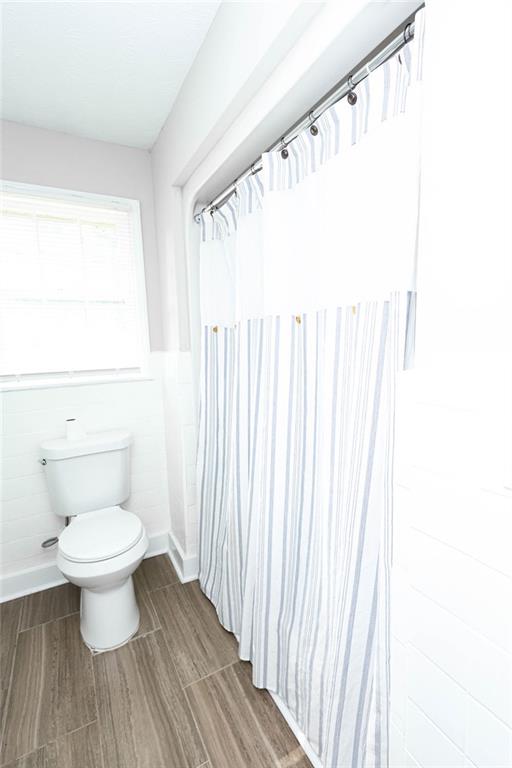 218 East Bonacre Road Cataula, GA 31804 - Photo 28 of 36 a bathroom with a toilet and a window