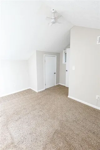 a view of a storage & utility room with a window