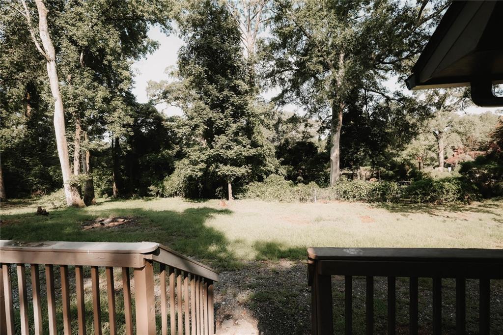 218 East Bonacre Road Cataula, GA 31804 - Photo 34 of 36 a view of a yard with wooden fence and trees