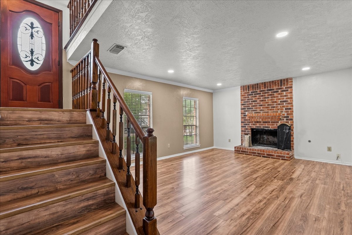 430 Redway Lane Houston, TX 77598 - Photo 8 of 43 a view of an entryway with wooden floor