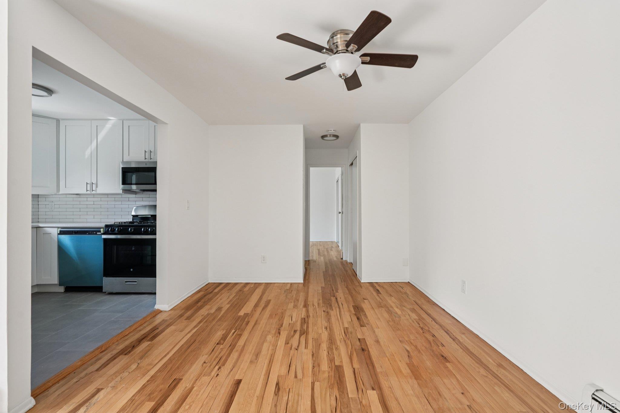 148 Sneden Place West, Unit 148 Spring Valley, NY 10977 - Photo 13 of 37 a view of empty room with wooden floor and window