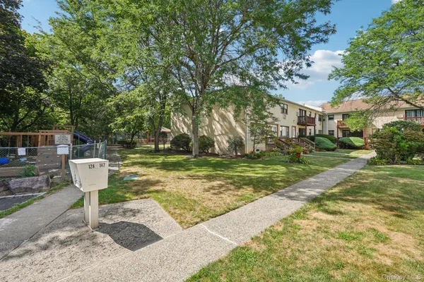a table and chairs sitting in the middle of yard