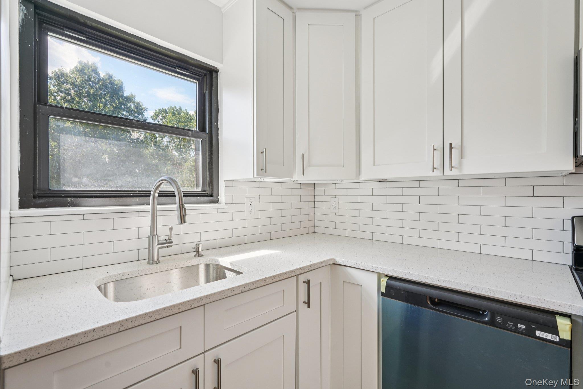 148 Sneden Place West, Unit 148 Spring Valley, NY 10977 - Photo 21 of 37 a view with a sink and cabinets