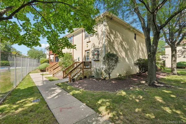 a view of a yard with a tree