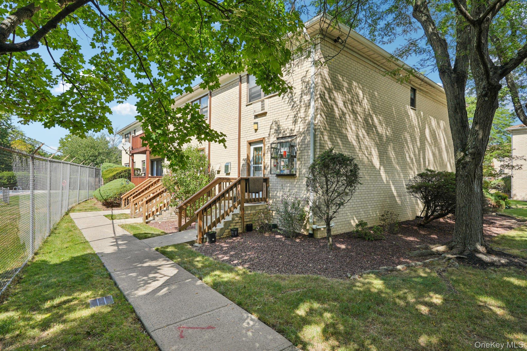 148 Sneden Place West, Unit 148 Spring Valley, NY 10977 - Photo 5 of 37 a view of a park with a tree