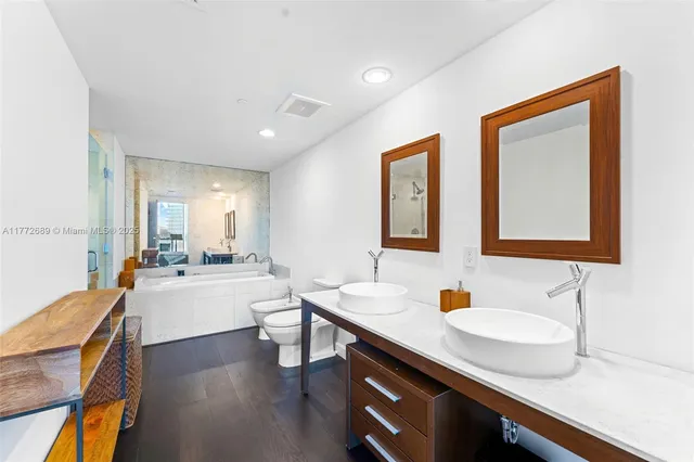 a large white kitchen with a large window