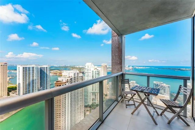 a view of a balcony with furniture