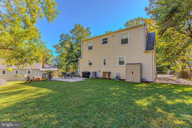 a view of a swimming pool with an outdoor space and seating area