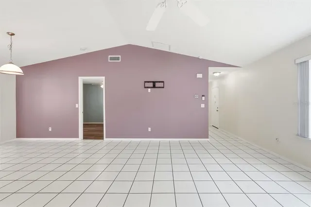 a kitchen with stainless steel appliances granite countertop a refrigerator a stove a sink and a oven