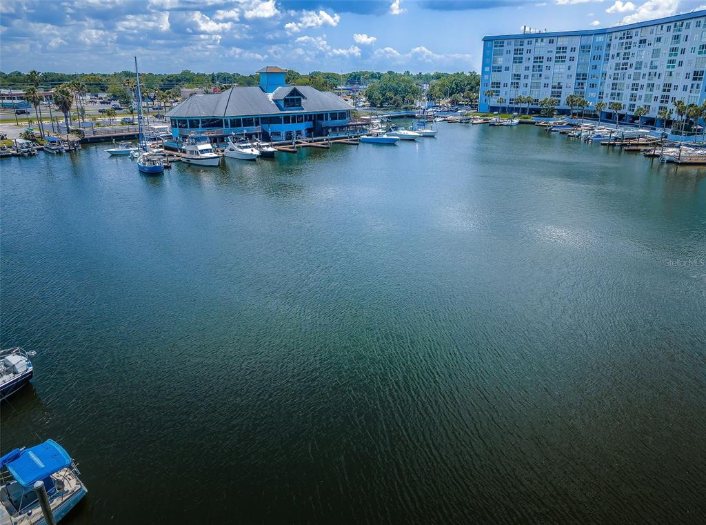 5157 Silent Loop, Unit 301 New Port Richey, FL 34652 - Photo 1 of 71 an aerial view of residential houses with outdoor space and lake view