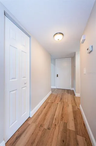 a view of a room with wooden floor and staircase