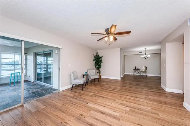 a kitchen with kitchen island granite countertop wooden cabinets and a granite counter tops