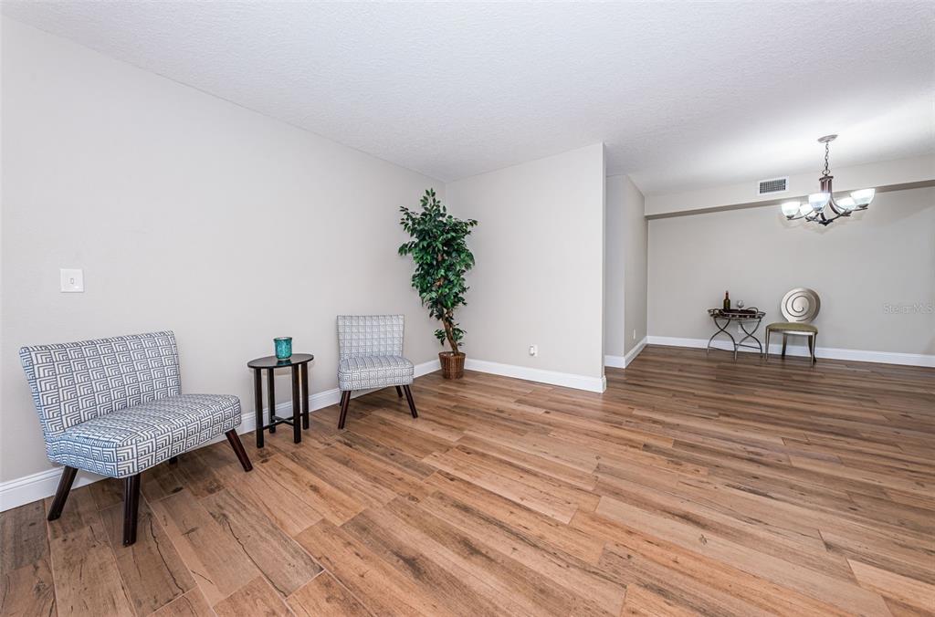 5157 Silent Loop, Unit 301 New Port Richey, FL 34652 - Photo 17 of 71 a living room with furniture and a potted plant