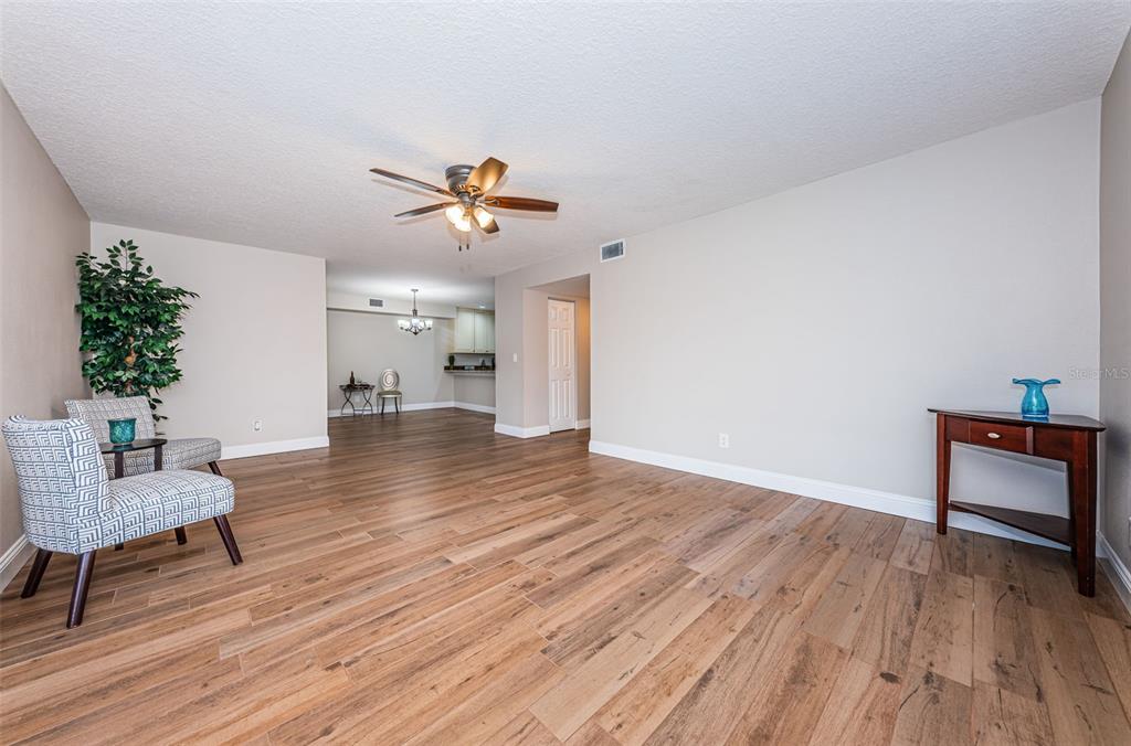 5157 Silent Loop, Unit 301 New Port Richey, FL 34652 - Photo 18 of 71 a view of an empty room and wooden floor