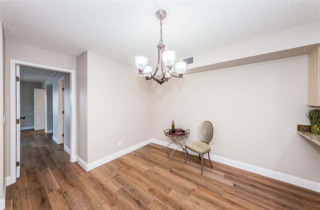 5157 Silent Loop, Unit 301 New Port Richey, FL 34652 - Photo 20 of 71 a view of a room with wooden floor and staircase