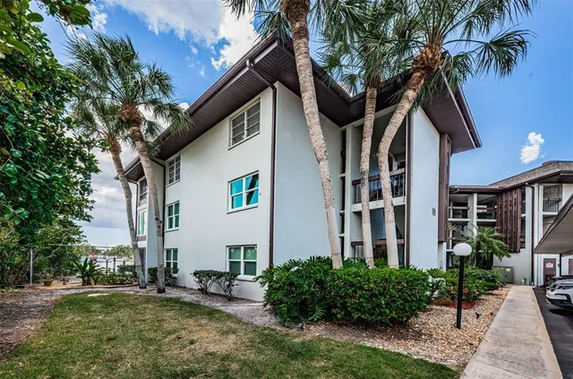 an aerial view of a house with a lake