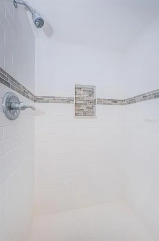 a picture of a bench in front of a wall