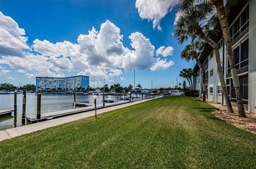 5157 Silent Loop, Unit 301 New Port Richey, FL 34652 - Photo 49 of 71 a view of a swimming pool with a yard