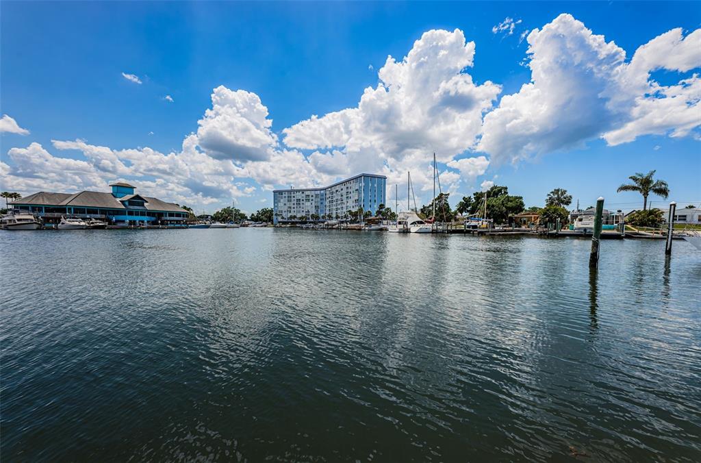 5157 Silent Loop, Unit 301 New Port Richey, FL 34652 - Photo 50 of 71 a view of a lake with houses in the back