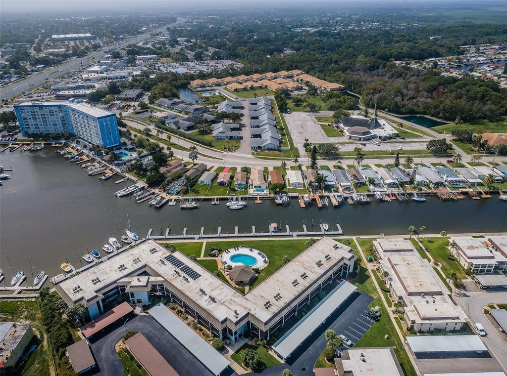 5157 Silent Loop, Unit 301 New Port Richey, FL 34652 - Photo 5 of 71 an aerial view of a house with a lake