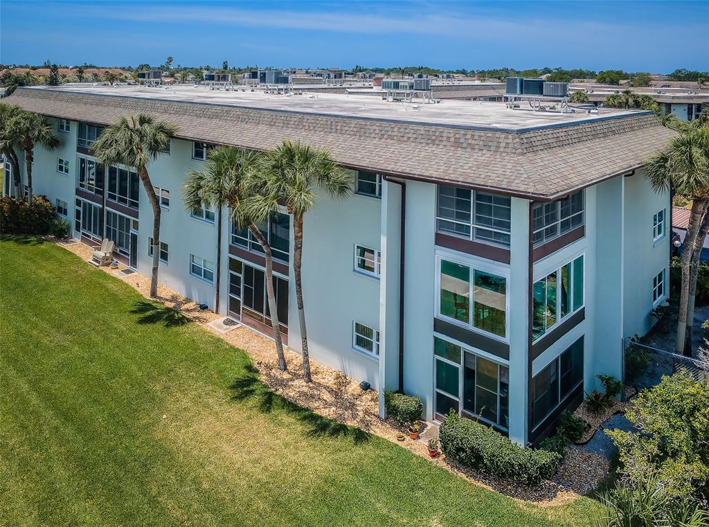 5157 Silent Loop, Unit 301 New Port Richey, FL 34652 - Photo 53 of 71 an aerial view of a house with a yard