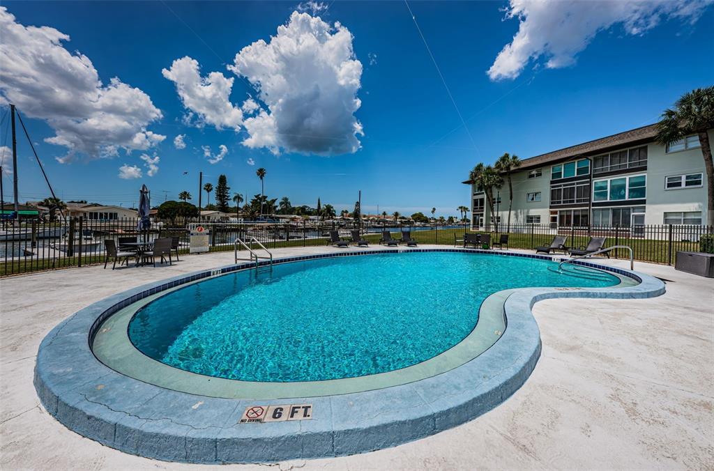 5157 Silent Loop, Unit 301 New Port Richey, FL 34652 - Photo 60 of 71 a view of a swimming pool with outdoor seating