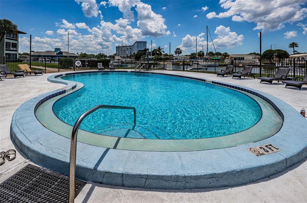 5157 Silent Loop, Unit 301 New Port Richey, FL 34652 - Photo 61 of 71 a view of a swimming pool with outdoor seating