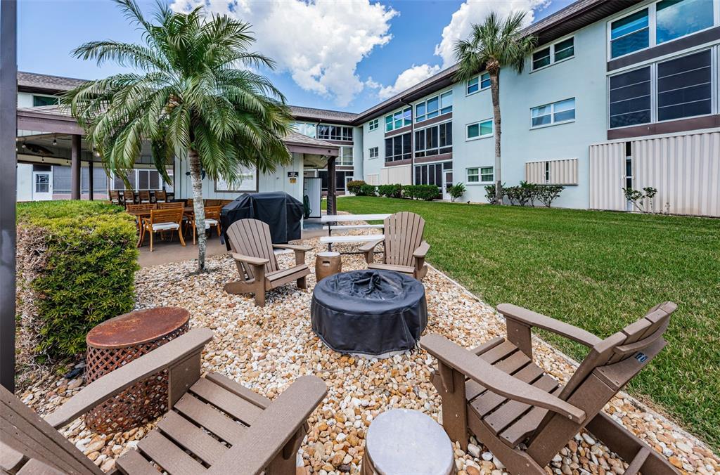 5157 Silent Loop, Unit 301 New Port Richey, FL 34652 - Photo 64 of 71 a view of a backyard with plants and a patio