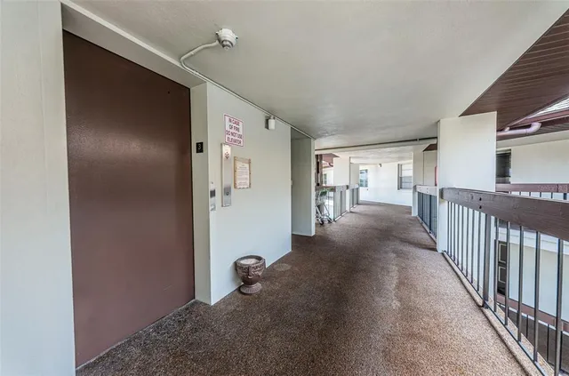 a view of a room with wooden floor and workspace