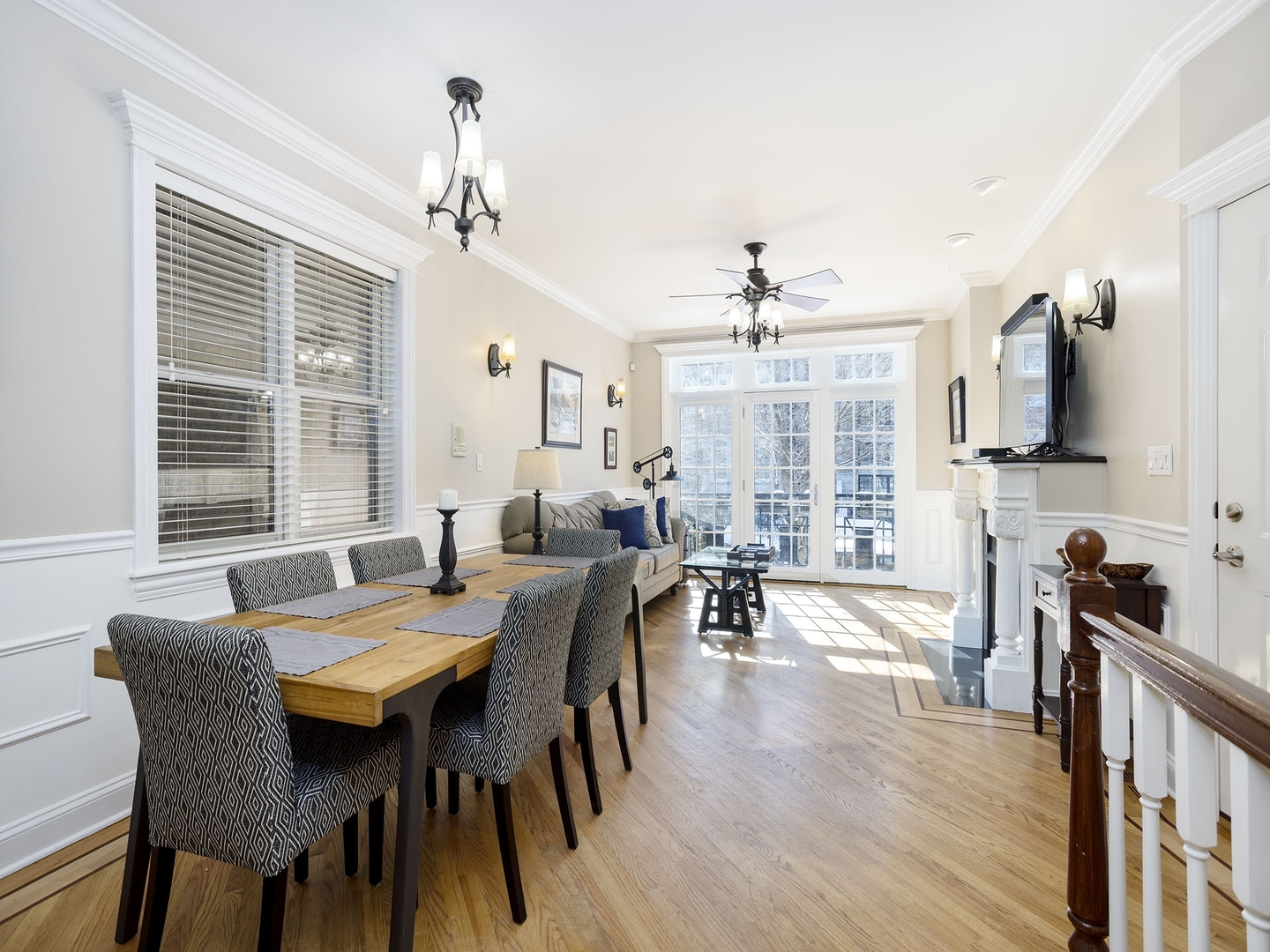 910 West Roscoe Street, Unit 1 Chicago, IL 60657 - Photo 5 of 13 a view of a dining room with furniture window and wooden floor