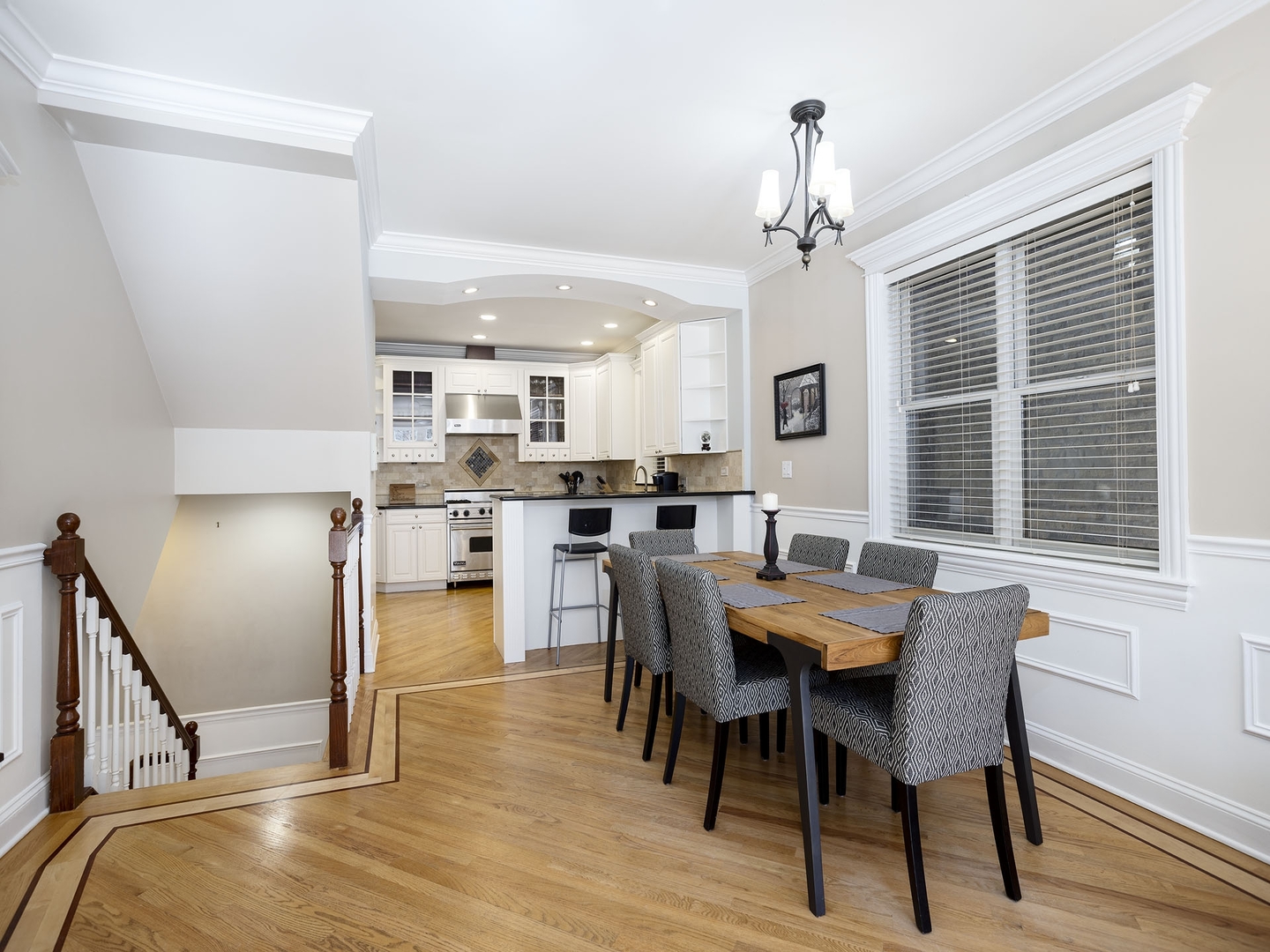 910 West Roscoe Street, Unit 1 Chicago, IL 60657 - Photo 6 of 13 a view of a dining room with furniture window and wooden floor