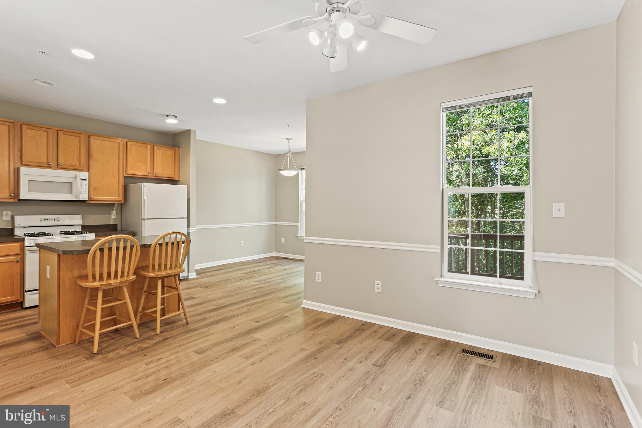 804 Patuxent Run Circle Odenton, MD 21113 - Photo 12 of 29 a view of a kitchen with wooden floor and windows