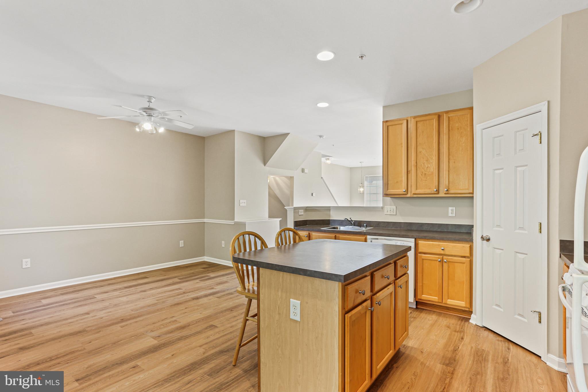 804 Patuxent Run Circle Odenton, MD 21113 - Photo 13 of 29 a kitchen with stainless steel appliances granite countertop a sink stove and cabinets