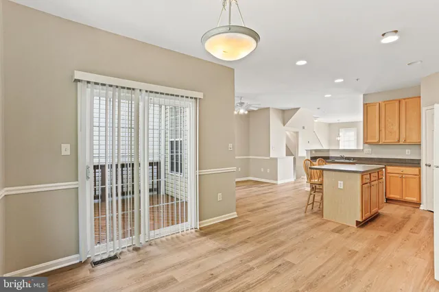 a kitchen with a refrigerator and a sink