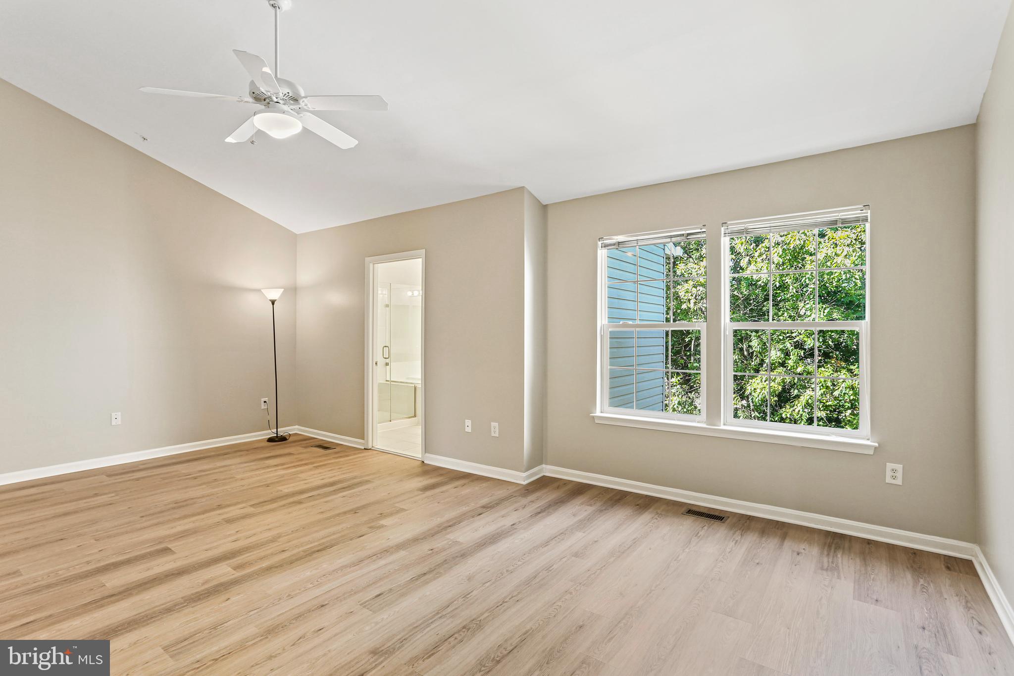 804 Patuxent Run Circle Odenton, MD 21113 - Photo 18 of 29 wooden floor in an empty room with a window