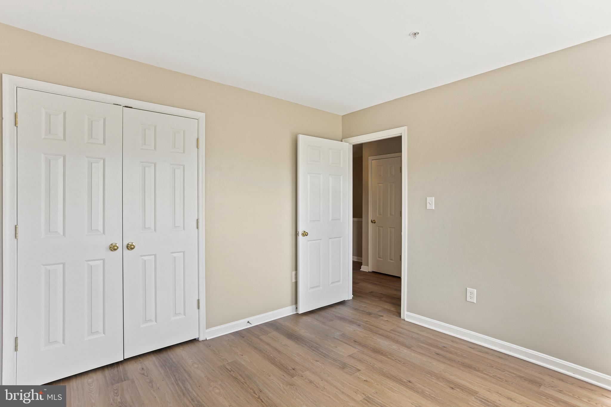 804 Patuxent Run Circle Odenton, MD 21113 - Photo 25 of 29 a view of an empty room with wooden floor