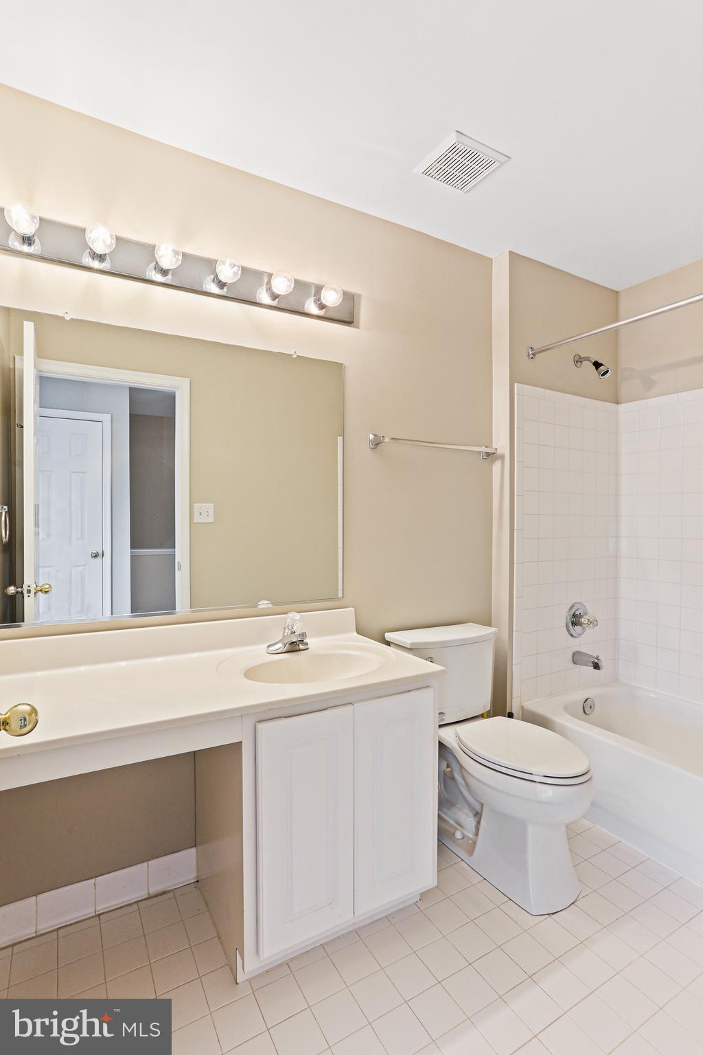 804 Patuxent Run Circle Odenton, MD 21113 - Photo 27 of 29 a bathroom with a double vanity sink mirror and toilet