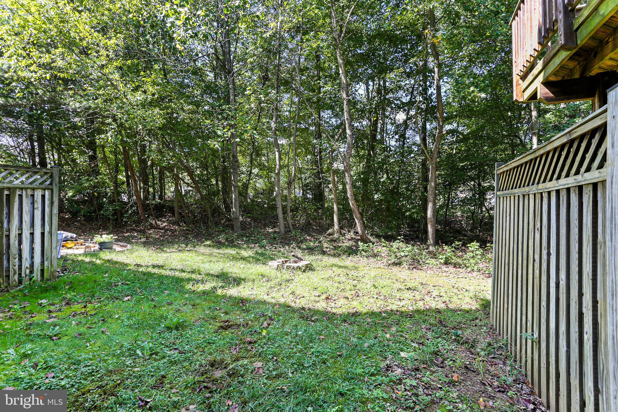804 Patuxent Run Circle Odenton, MD 21113 - Photo 29 of 29 a view of a yard with plants and wooden fence