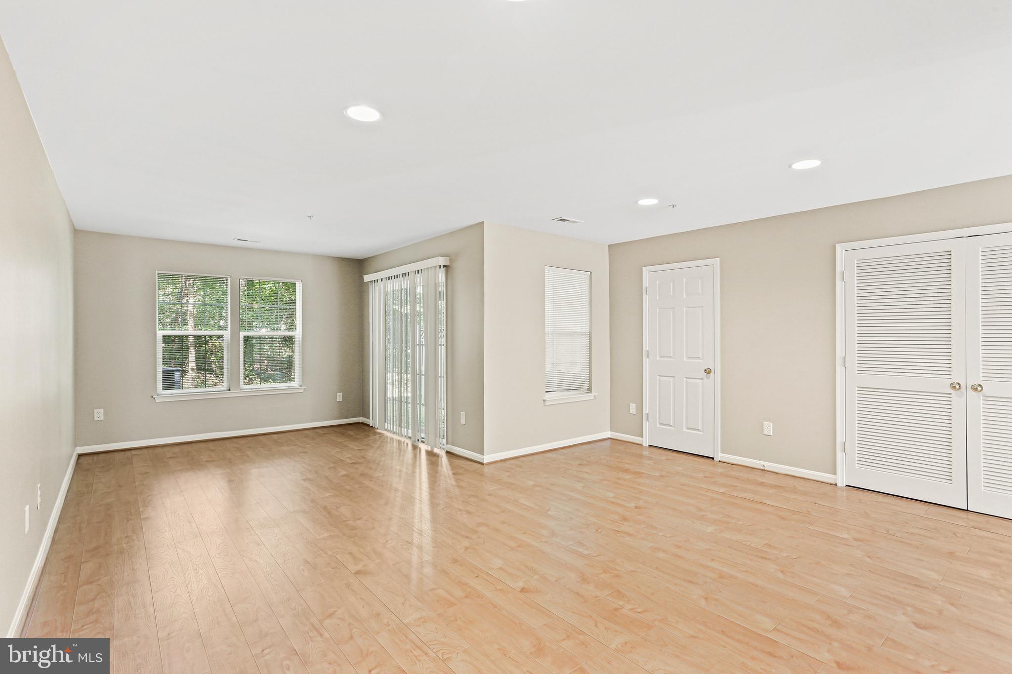 804 Patuxent Run Circle Odenton, MD 21113 - Photo 3 of 29 a view of an empty room with wooden floor and a window