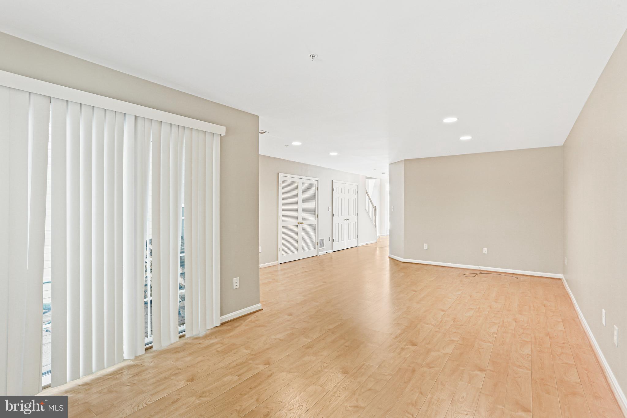 804 Patuxent Run Circle Odenton, MD 21113 - Photo 4 of 29 a view of an empty room with wooden floor