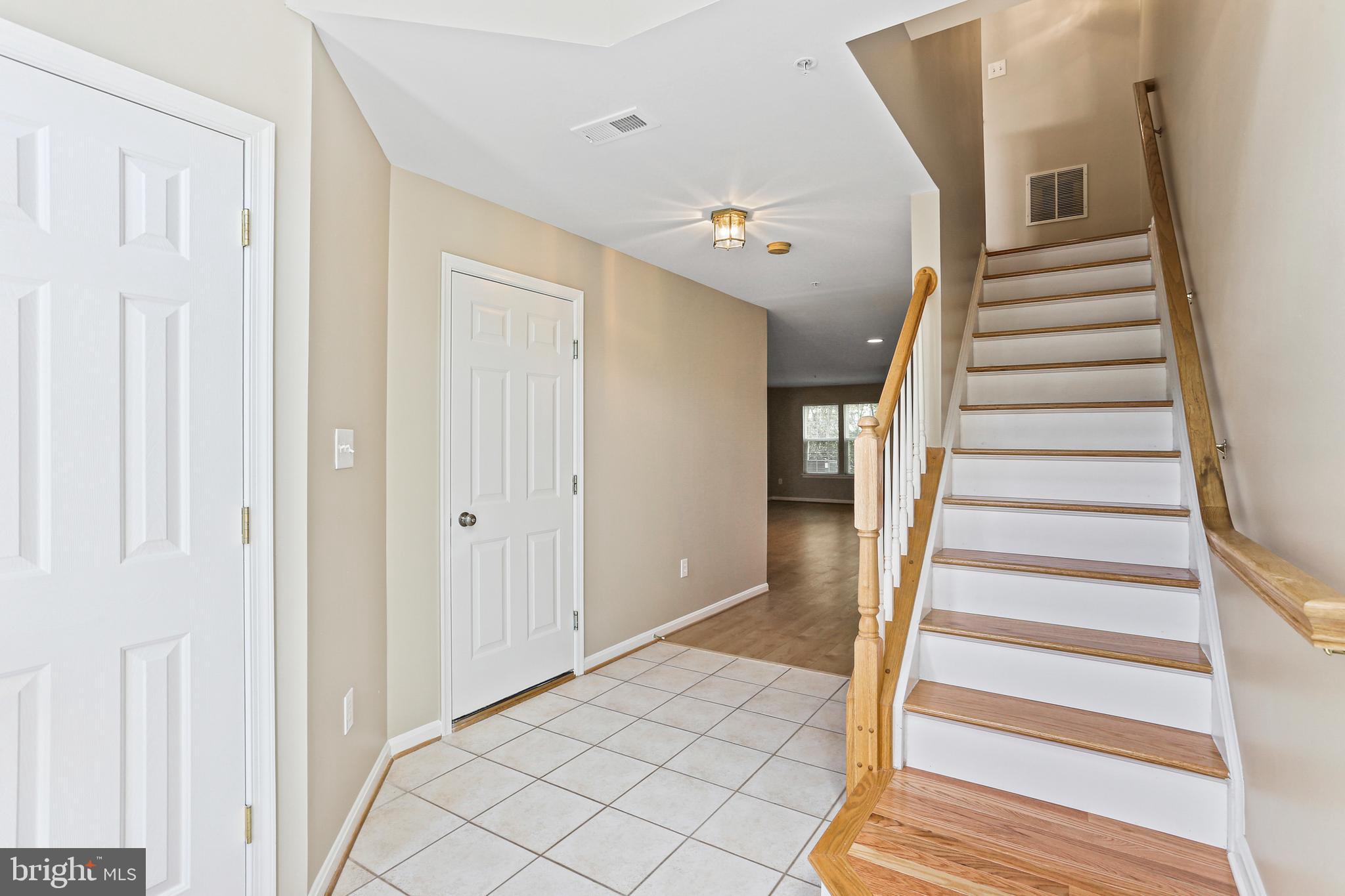 804 Patuxent Run Circle Odenton, MD 21113 - Photo 5 of 29 a view of entryway and hall with wooden floor