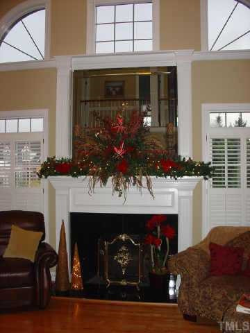 390 Dogeye Road Benson, NC 27504 - Photo 4 of 10 Gorgeous 2 story mantel/fireplace with set in mirror in the family room. Other