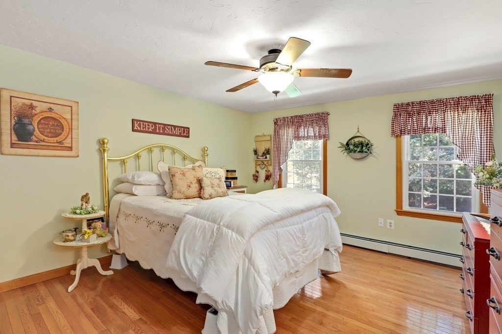 10 Quail Run Road Bellingham, MA 02019 - Photo 25 of 40 a bedroom with a bed and a window