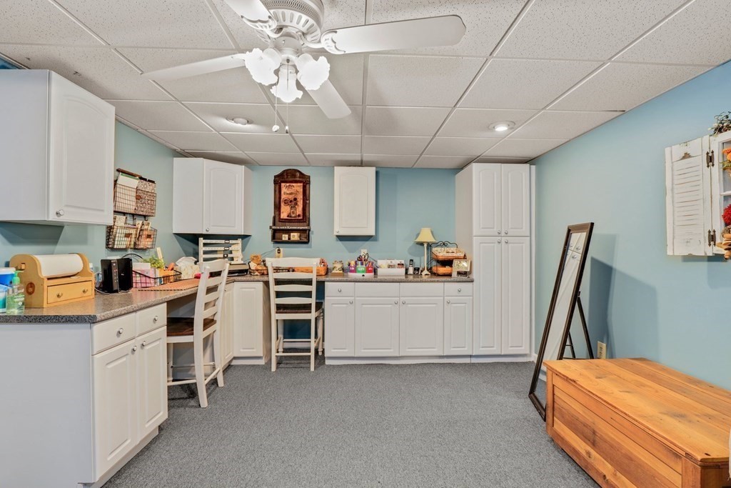 10 Quail Run Road Bellingham, MA 02019 - Photo 30 of 40 a view of a kitchen with fridge and a sink