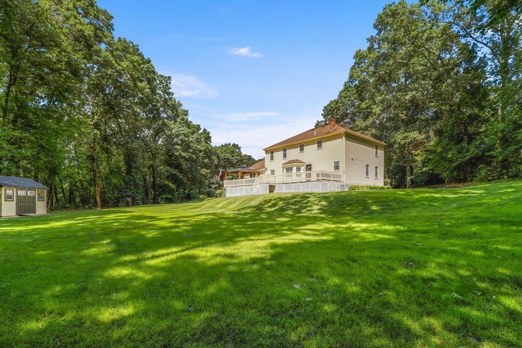 10 Quail Run Road Bellingham, MA 02019 - Photo 38 of 40 a view of a house with a yard