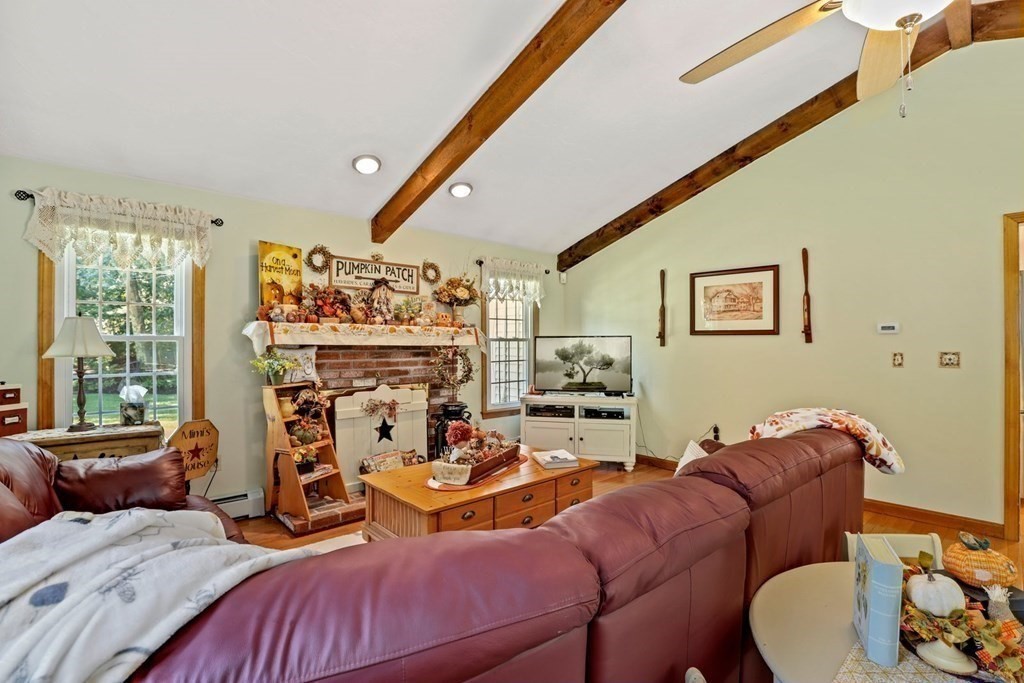 10 Quail Run Road Bellingham, MA 02019 - Photo 8 of 40 a living room with furniture a rug and a large window