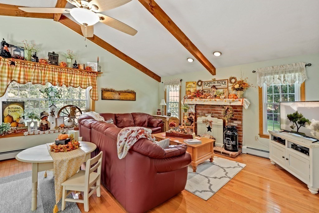 10 Quail Run Road Bellingham, MA 02019 - Photo 10 of 40 a living room with furniture and a fireplace