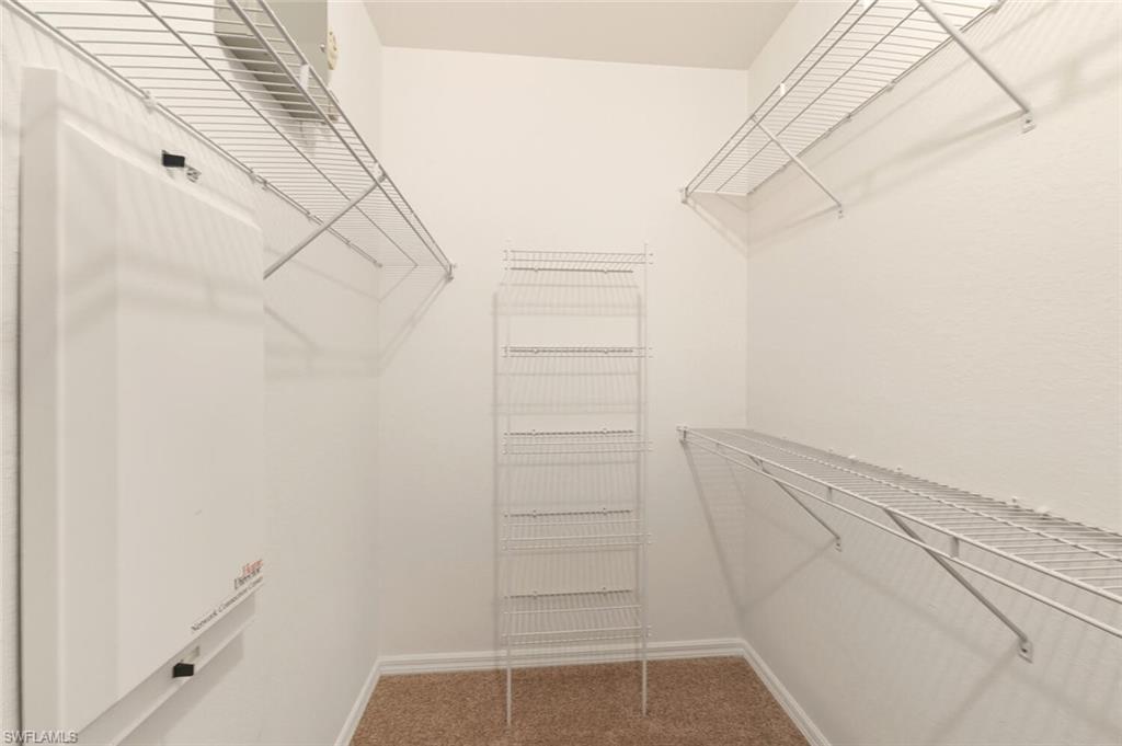 7005 Pinnacle Lane, Unit 1501 Naples, FL 34110 - Photo 21 of 46 a view of walk in closet